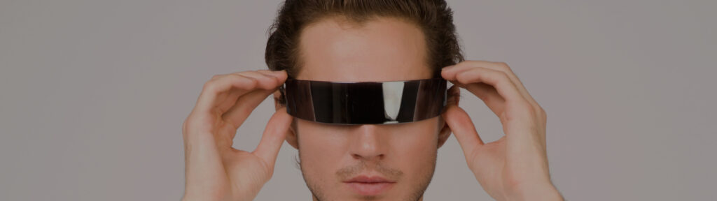 A man puts on Augmented Reality glasses.